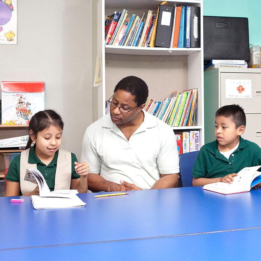 Student works with students in an afterschool tutoring program.