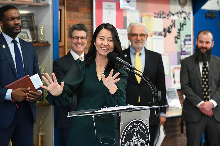 Mayor Wu speaks as Chancellor Marcelo Suárez-Orozco and city officials look on.